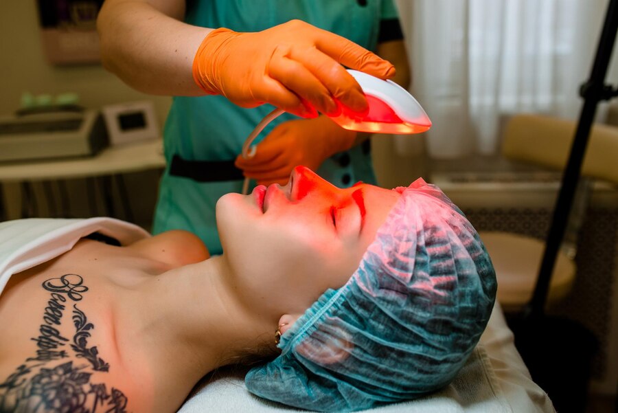 closeup-beautician-using-laser-therapy-facial-skin-rejuvenation-beautiful-healthy-woman-face-getting-skin-resurfacing-spa-salon_88340-5727